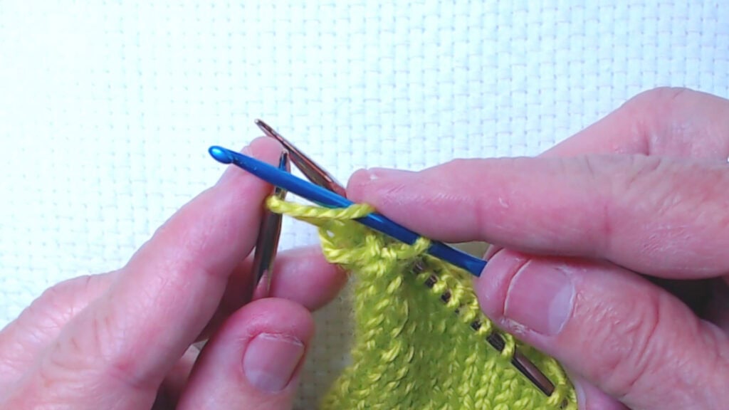 repaired stitch goes back on left needle