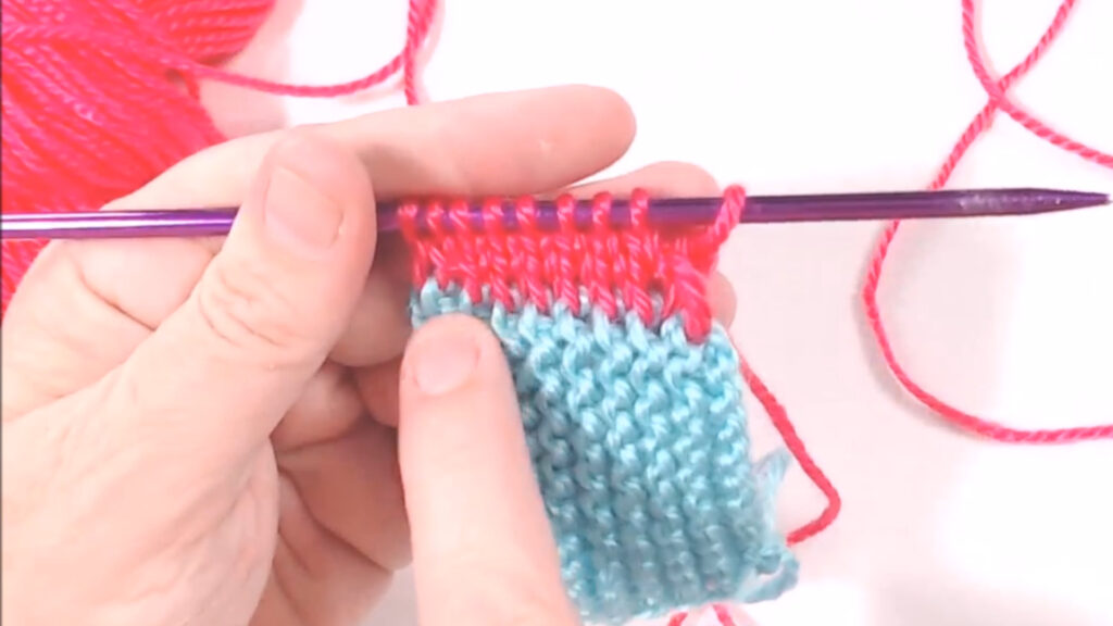 pointing at picked up stitches
Stitch Control
