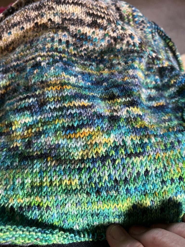 random yarn is knitted together into interesting fabric