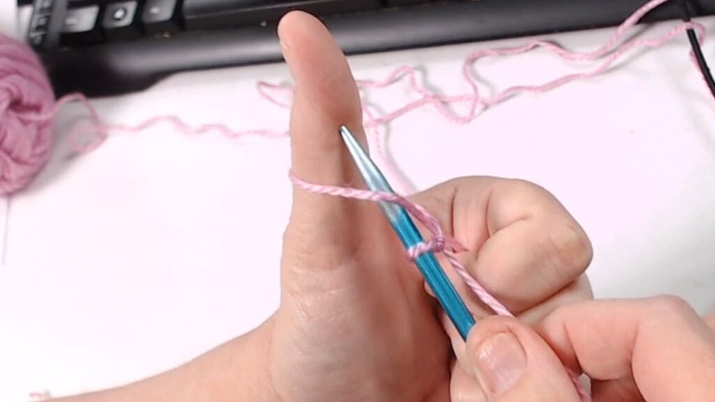 needle under thumb loop