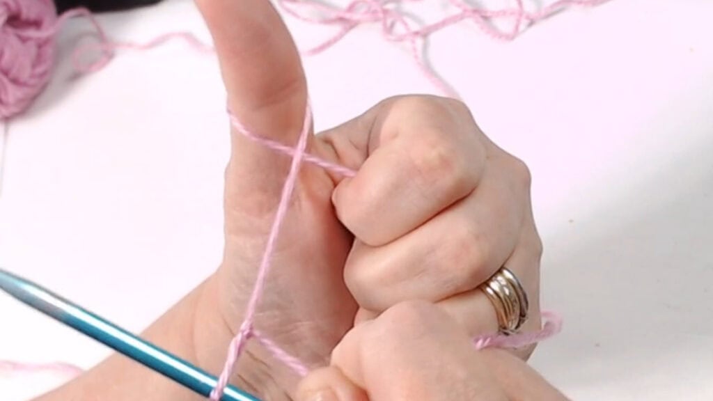 wrap thumb with yarn
